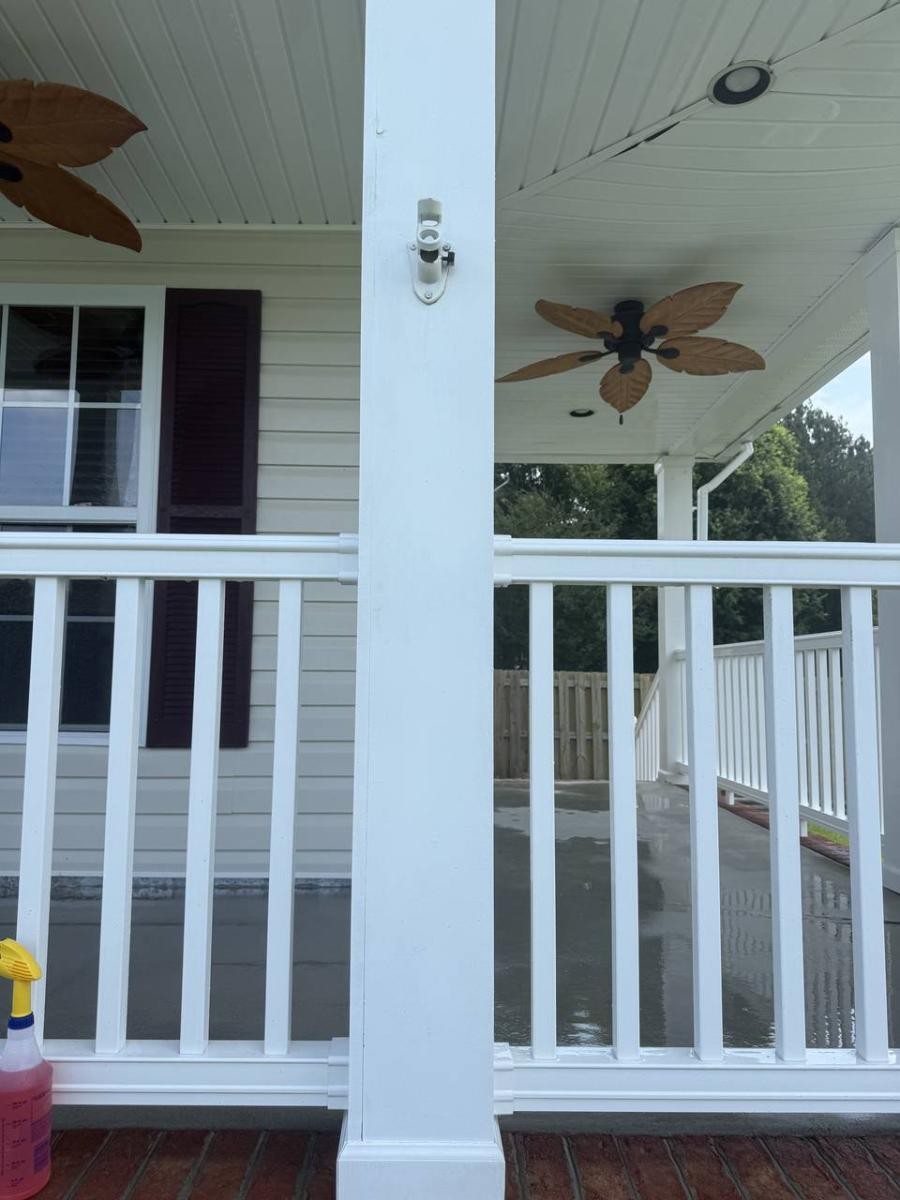 Beautiful restored wooden deck after professional cleaning showing natural wood grain and clean surface